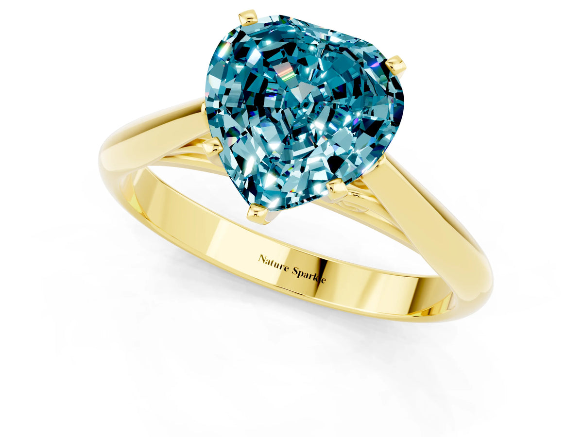 Heart Cut Blue Topaz Cathedral Solitaire Engagement Ring in Yellow gold with Prong Setting_1