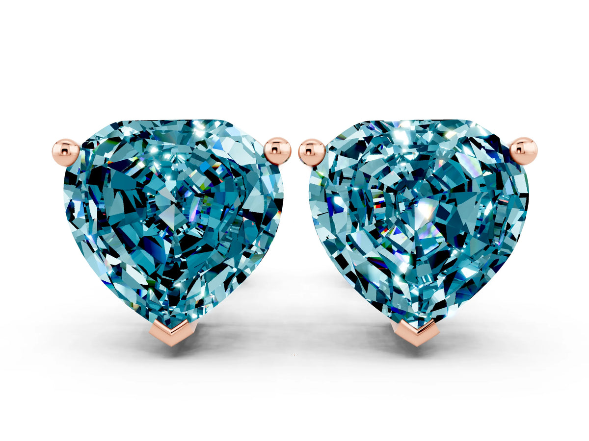 Heart Cut Blue Topaz Stud Earrings in Rose gold with Basket Setting