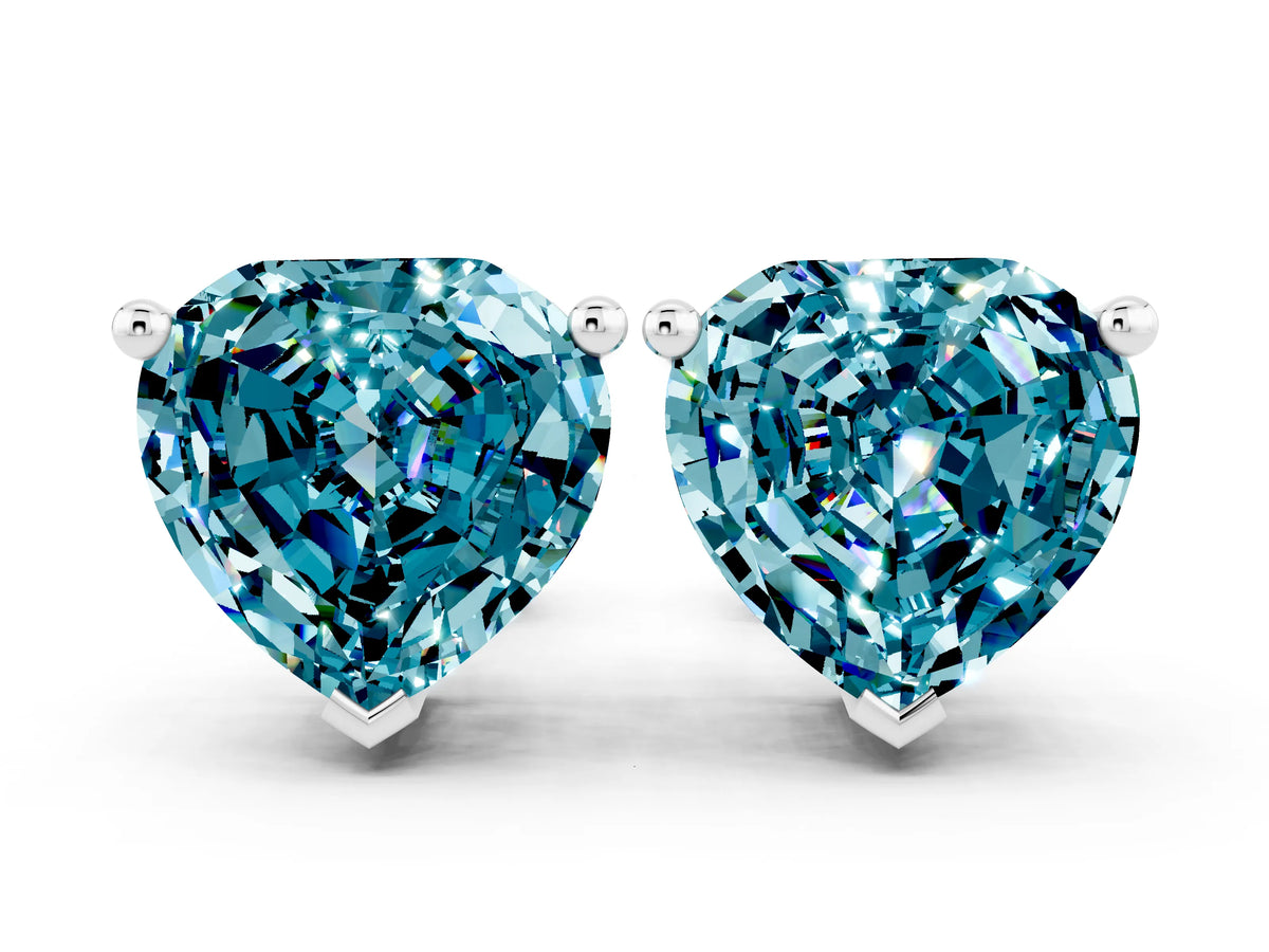 Heart Cut Blue Topaz Stud Earrings in White gold with Basket Setting