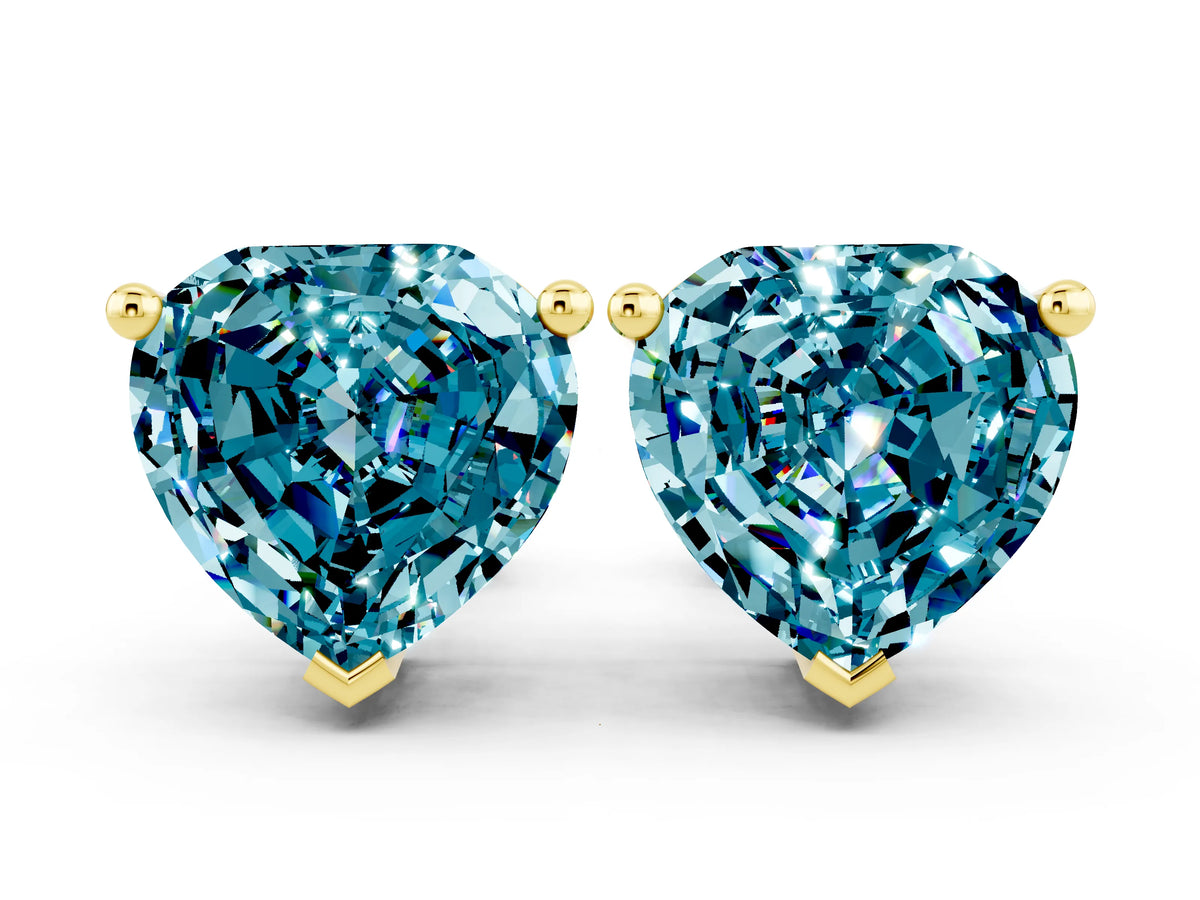 Heart Cut Blue Topaz Stud Earrings in Yellow gold with Basket Setting