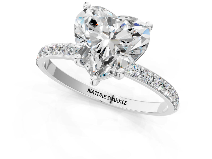 Heart Cut Diamond Solitaire Ring in Silver with Round Pavé Band