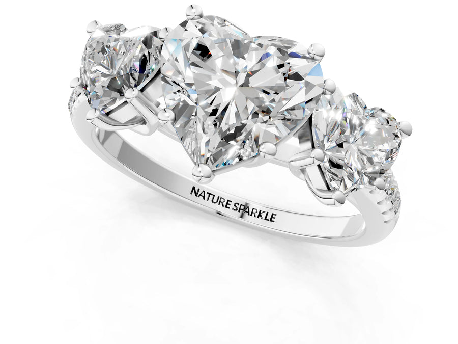 Heart Cut Diamond Trellis Three-Stone Engagement Ring in Platinum with Round Side Stones