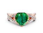 Heart Cut Emerald Solitaire Ring in Rose gold with Interwoven Pavé Band and Prong Setting