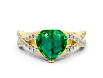 Heart Cut Emerald Solitaire Ring in Yellow gold with Interwoven Pavé Band and Prong Setting