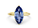 Marquise Cut Blue Sapphire Cathedral Solitaire Engagement Ring in Yellow gold with Prong Setting