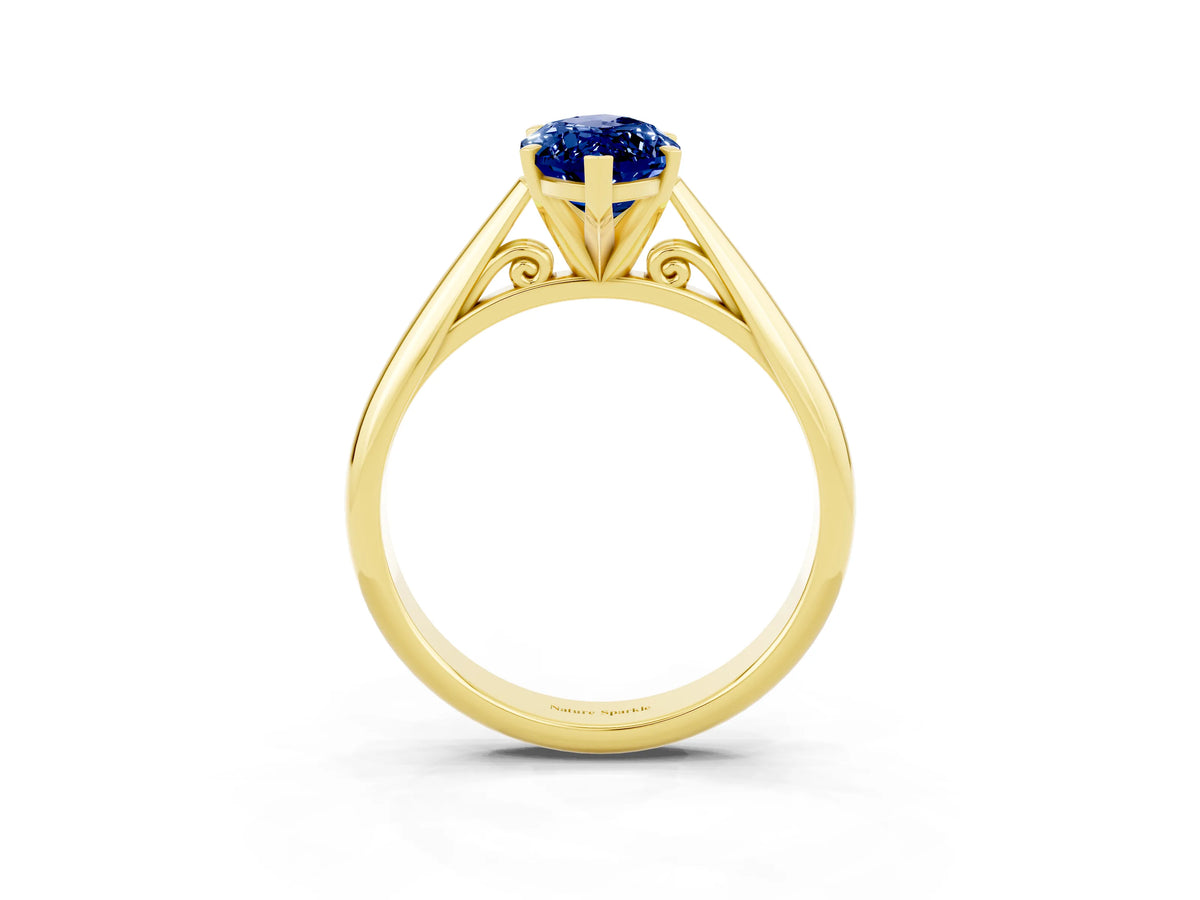 Marquise Cut Blue Sapphire Cathedral Solitaire Engagement Ring in Yellow gold with Prong Setting_3