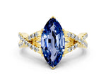 Marquise Cut Blue Sapphire Solitaire Ring in Yellow gold with Interwoven Pavé Band and Prong Setting