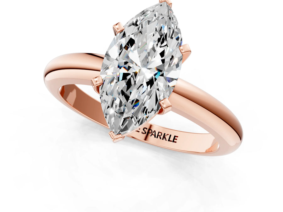 Marquise Cut Diamond Solitaire Ring in Rose gold with Prong Setting and Rounded Band