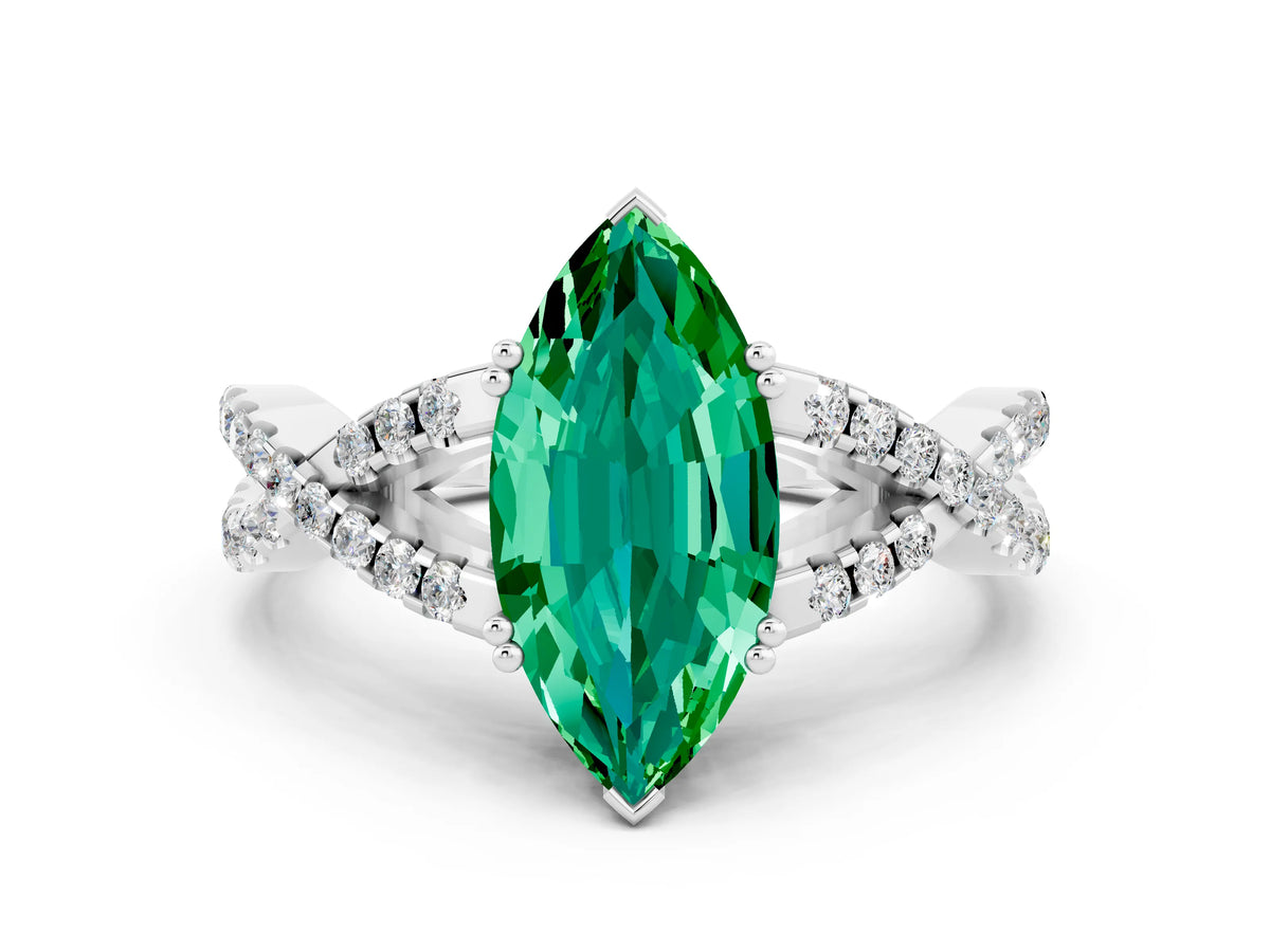 Marquise Cut Emerald Solitaire Ring in White gold with Interwoven Pavé Band and Prong Setting