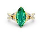 Marquise Cut Emerald Solitaire Ring in Yellow gold with Interwoven Pavé Band and Prong Setting