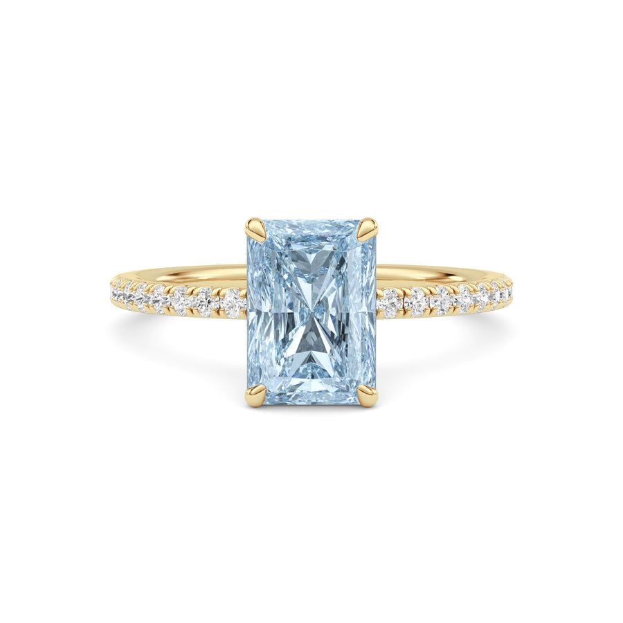 Yellow gold Fancy Blue Radiant Cut Diamond Solitaire with Pavé Band
