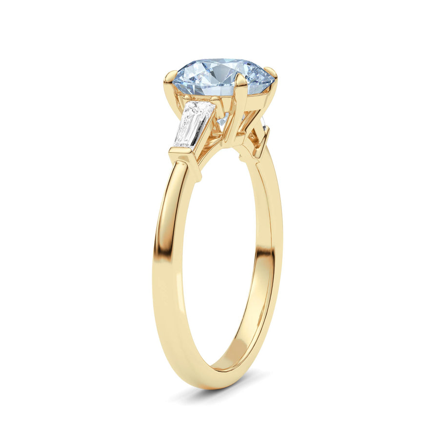 Yellow gold Three-Stone Fancy Blue Round Cut Diamond Ring with Tapered Baguette Side Stones