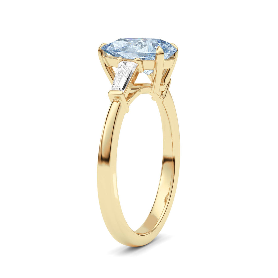 Yellow gold Three-Stone Fancy Blue Pear Cut Diamond Ring with Tapered Baguette Side Stones