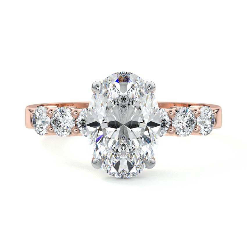 Rose gold Oval Diamond Engagement Ring with Graduated Side Stones and Prong Setting