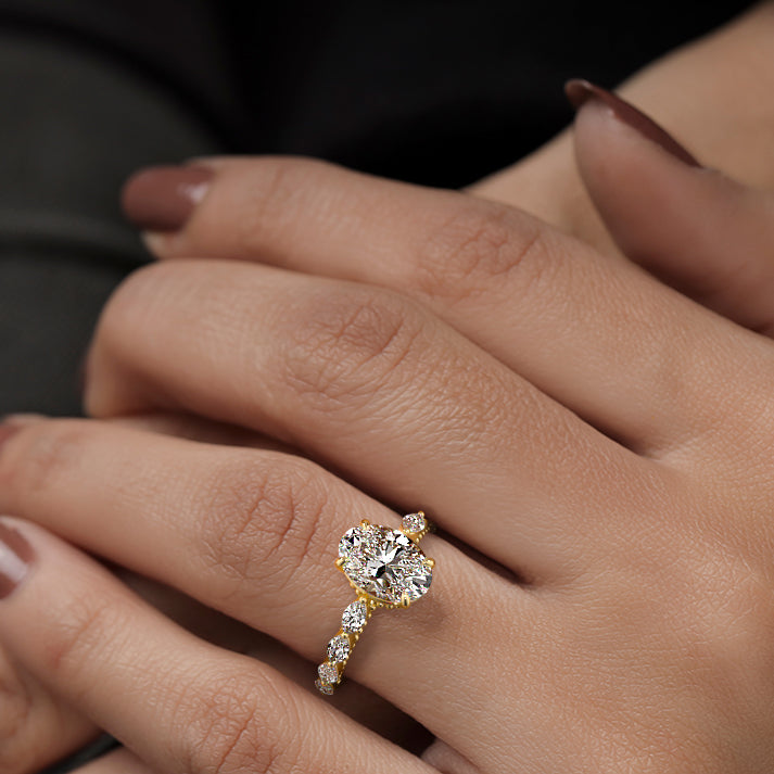 Yellow gold Oval Diamond Engagement Ring with Marquise Side Stones and Prong Setting
