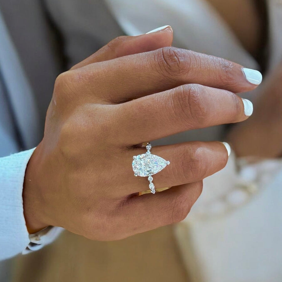 Silver Pear Diamond Engagement Ring with Marquise and Round Side Stones