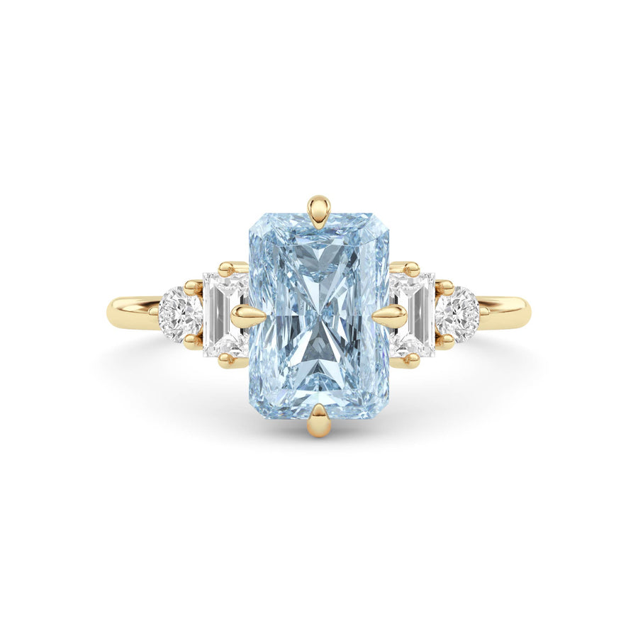 Yellow gold Fancy Blue Radiant Cut Three Stone Diamond Engagement Ring with Tapered Baguette and Round Side Stones