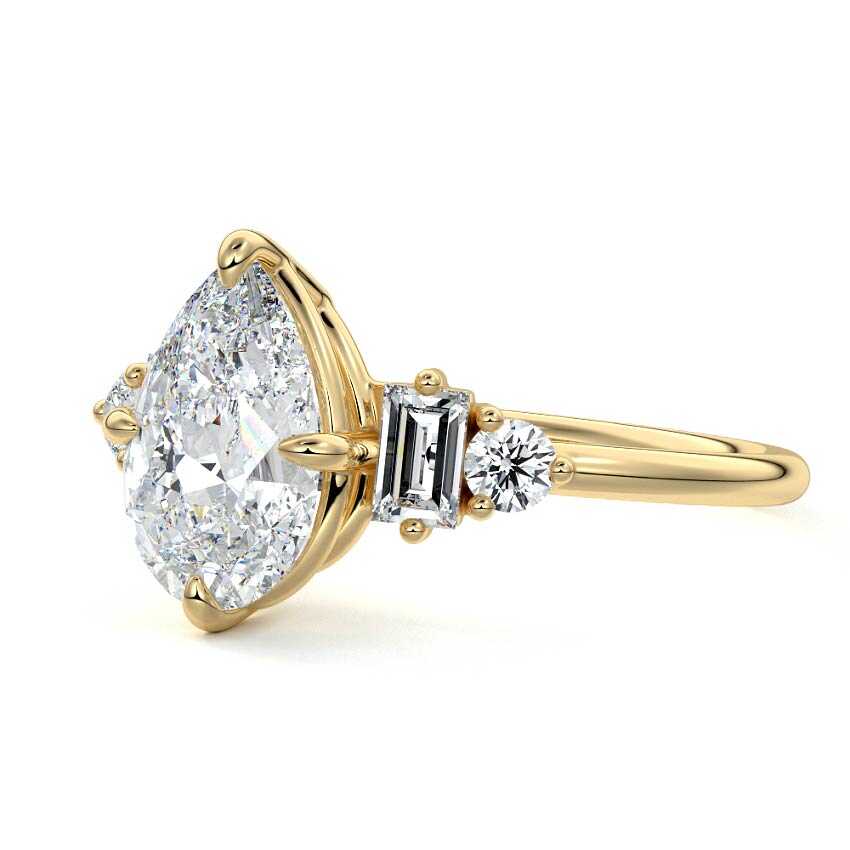 Yellow gold Pear Three Stone Diamond Engagement Ring with Tapered Baguette and Round Side Stones