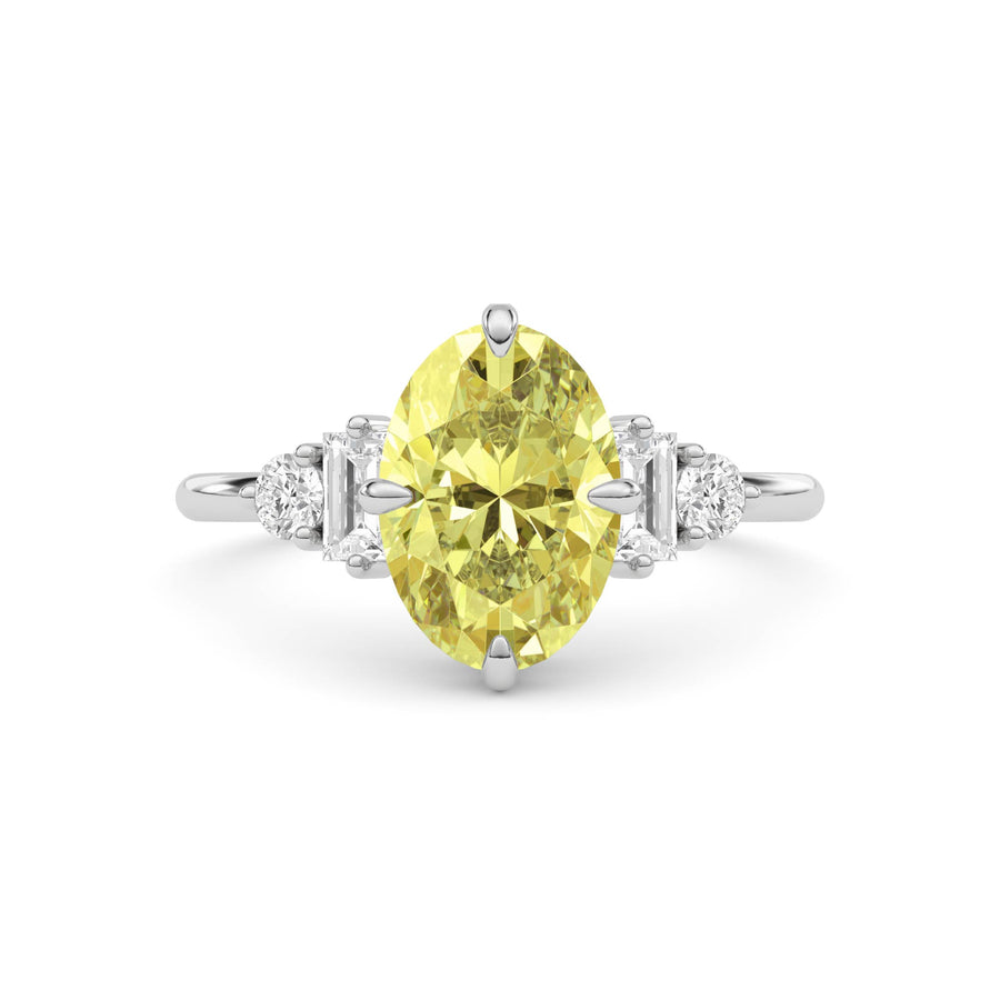 Yellow gold Fancy Yellow Oval Cut Three Stone Diamond Engagement Ring with Tapered Baguette and Round Side Stones