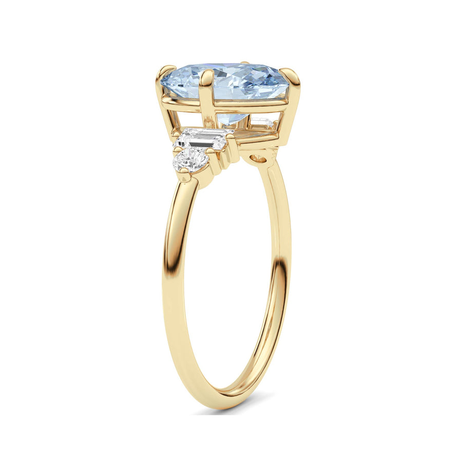 Yellow gold Fancy Blue Oval Cut Three Stone Diamond Engagement Ring with Tapered Baguette and Round Side Stones