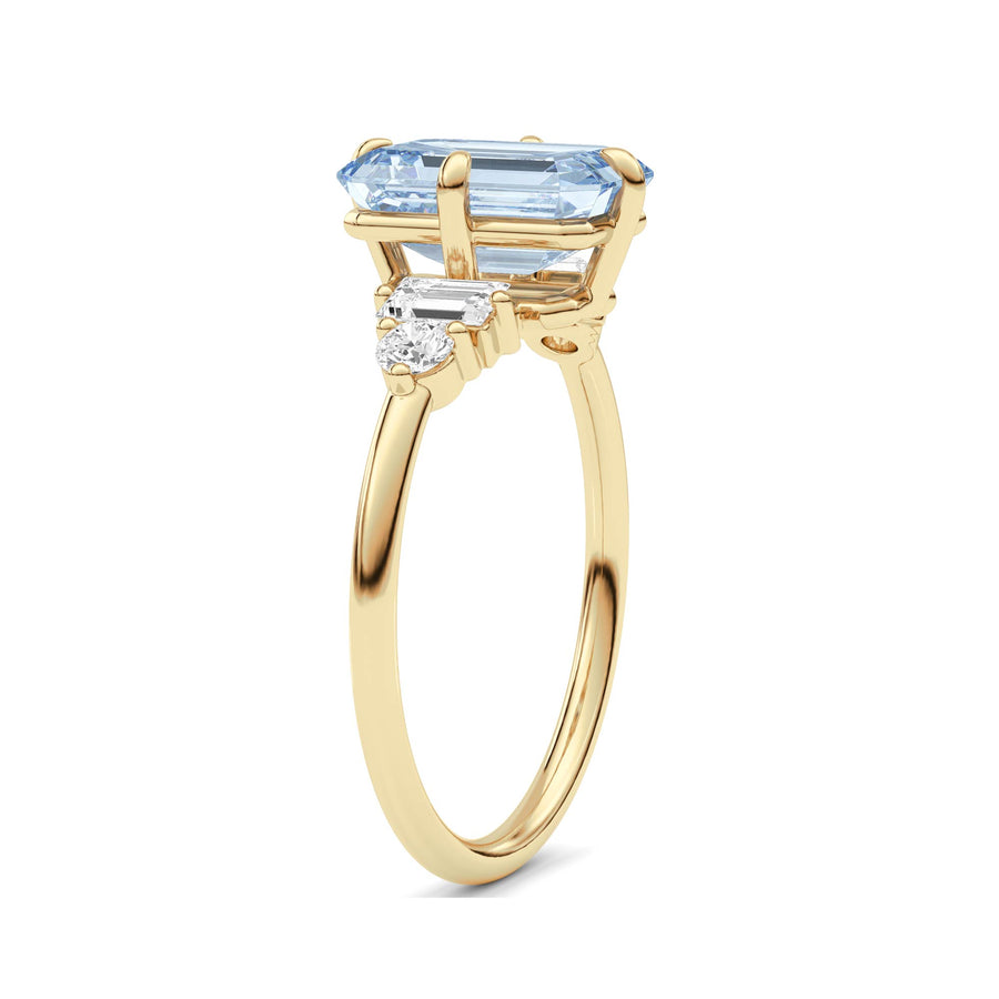 Yellow gold Fancy Blue Emerald Cut Three Stone Diamond Engagement Ring with Tapered Baguette and Round Side Stones