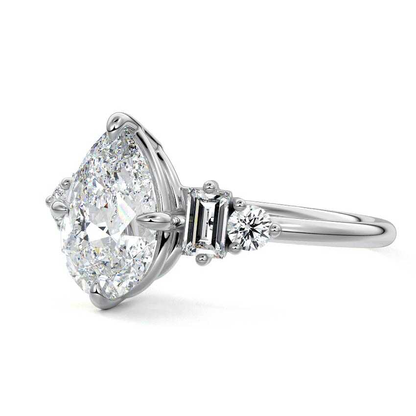 White gold Pear Three Stone Diamond Engagement Ring with Tapered Baguette and Round Side Stones