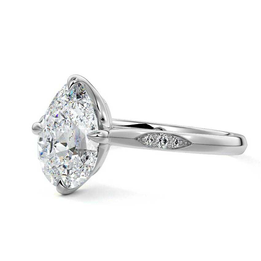 White gold Pear Diamond Side Stone Ring with Flush Set Round Accents in Prong Setting
