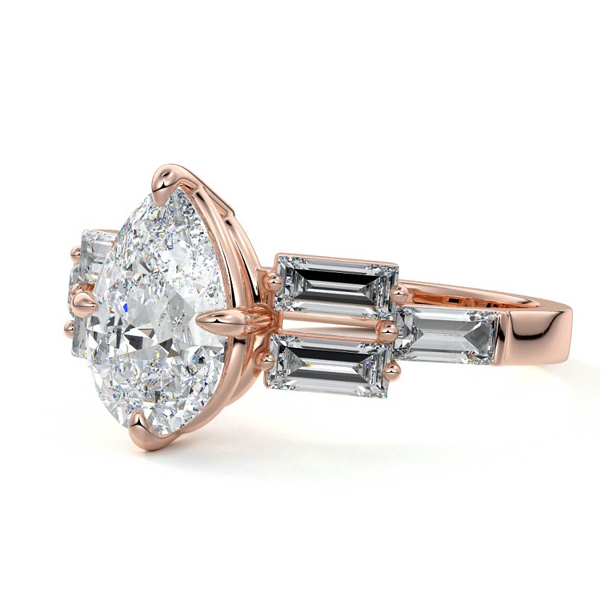Rose gold Pear Diamond Three-Stone Ring with Tapered Baguette Side Stones in Prong Setting