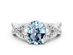 Oval Cut Aquamarine Solitaire Ring in White gold with Interwoven Pavé Band and Prong Setting