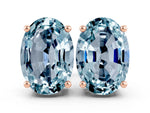 Oval Cut Aquamarine Stud Earrings in Rose gold with Basket Setting