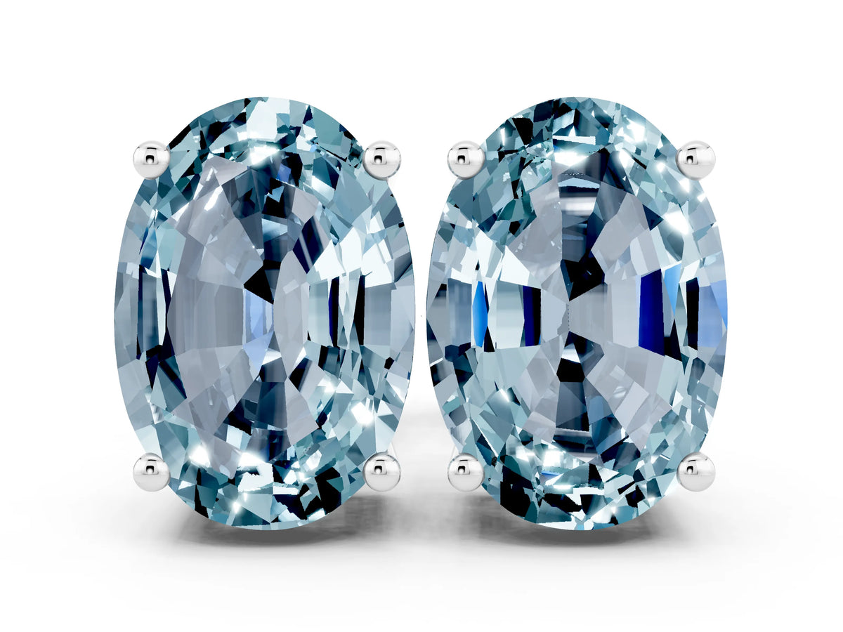 Oval Cut Aquamarine Stud Earrings in White gold with Basket Setting