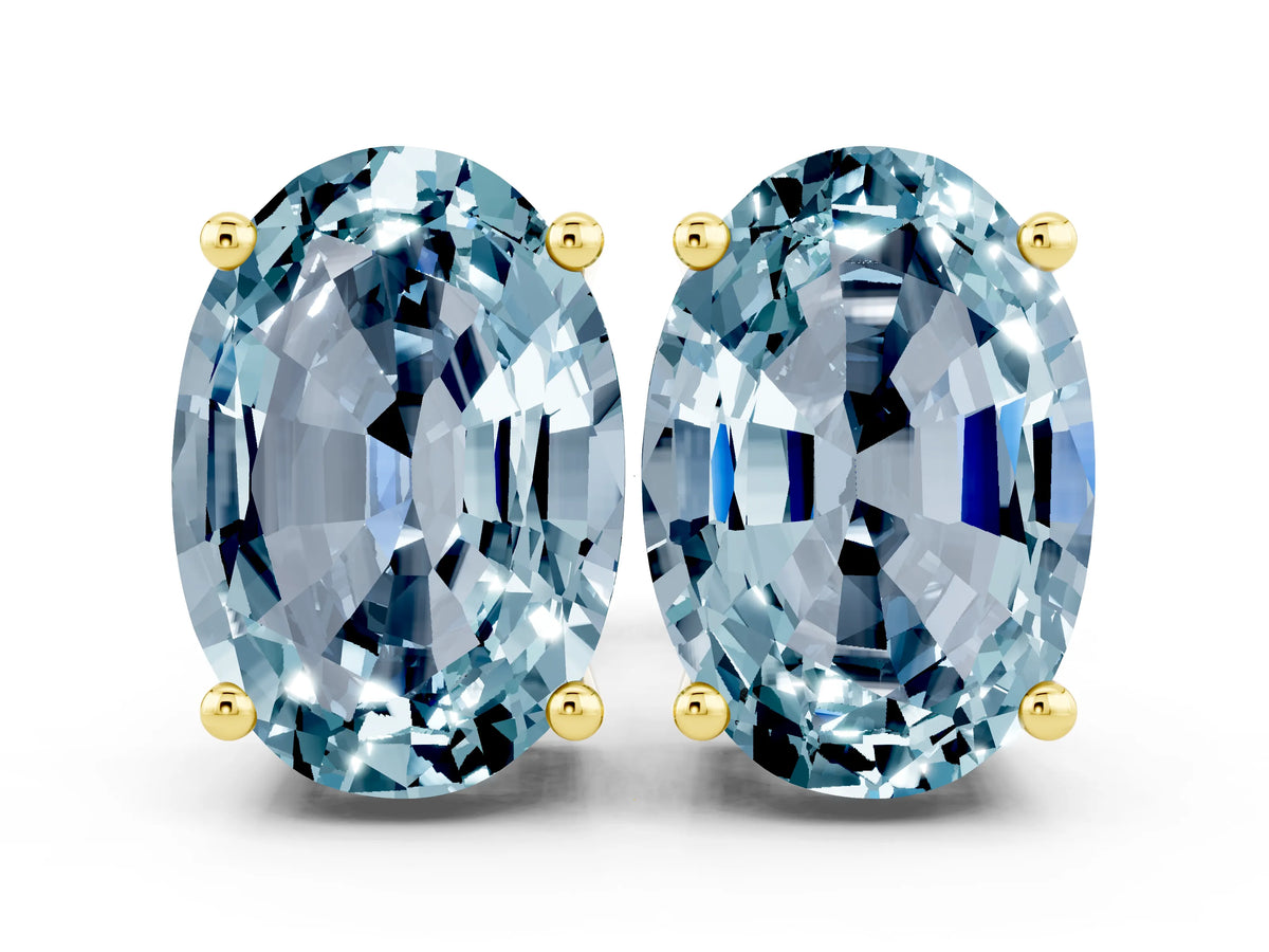 Oval Cut Aquamarine Stud Earrings in Yellow gold with Basket Setting