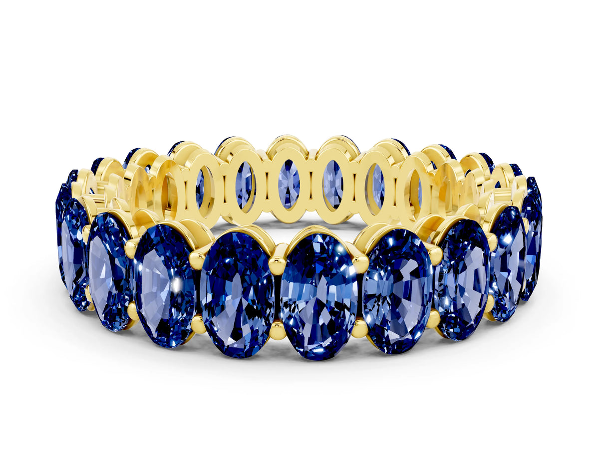 Oval Cut Blue Sapphire Eternity Band in Yellow gold with Shared Prong Setting