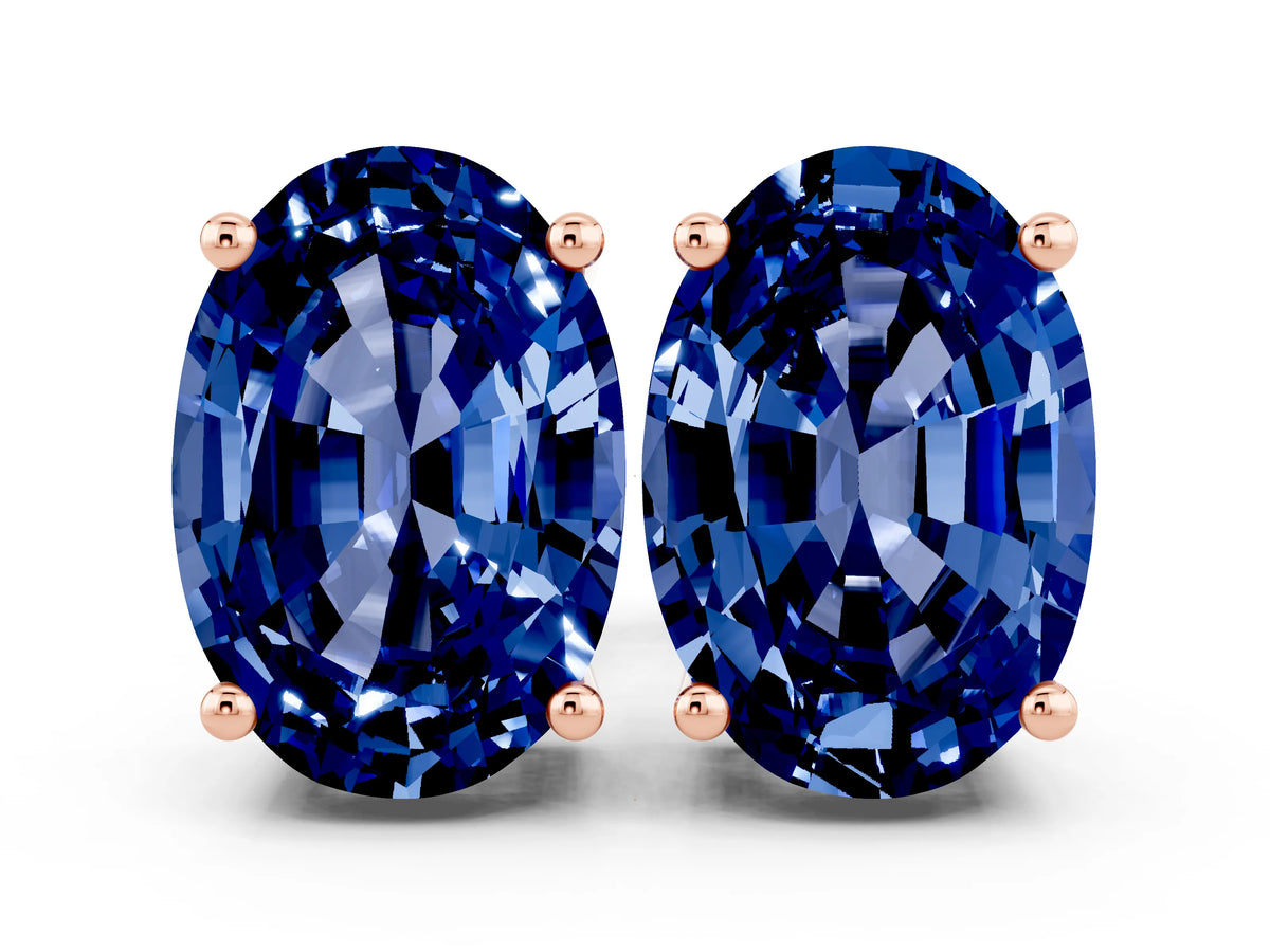 Oval Cut Blue Sapphire Stud Earrings in Rose gold with Basket Setting