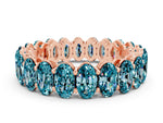 Oval Cut Blue Topaz Eternity Band in Rose gold with Shared Prong Setting