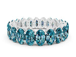 Oval Cut Blue Topaz Eternity Band in White gold with Shared Prong Setting