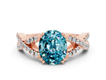 Oval Cut Blue Topaz Solitaire Ring in Rose gold with Interwoven Pavé Band and Prong Setting