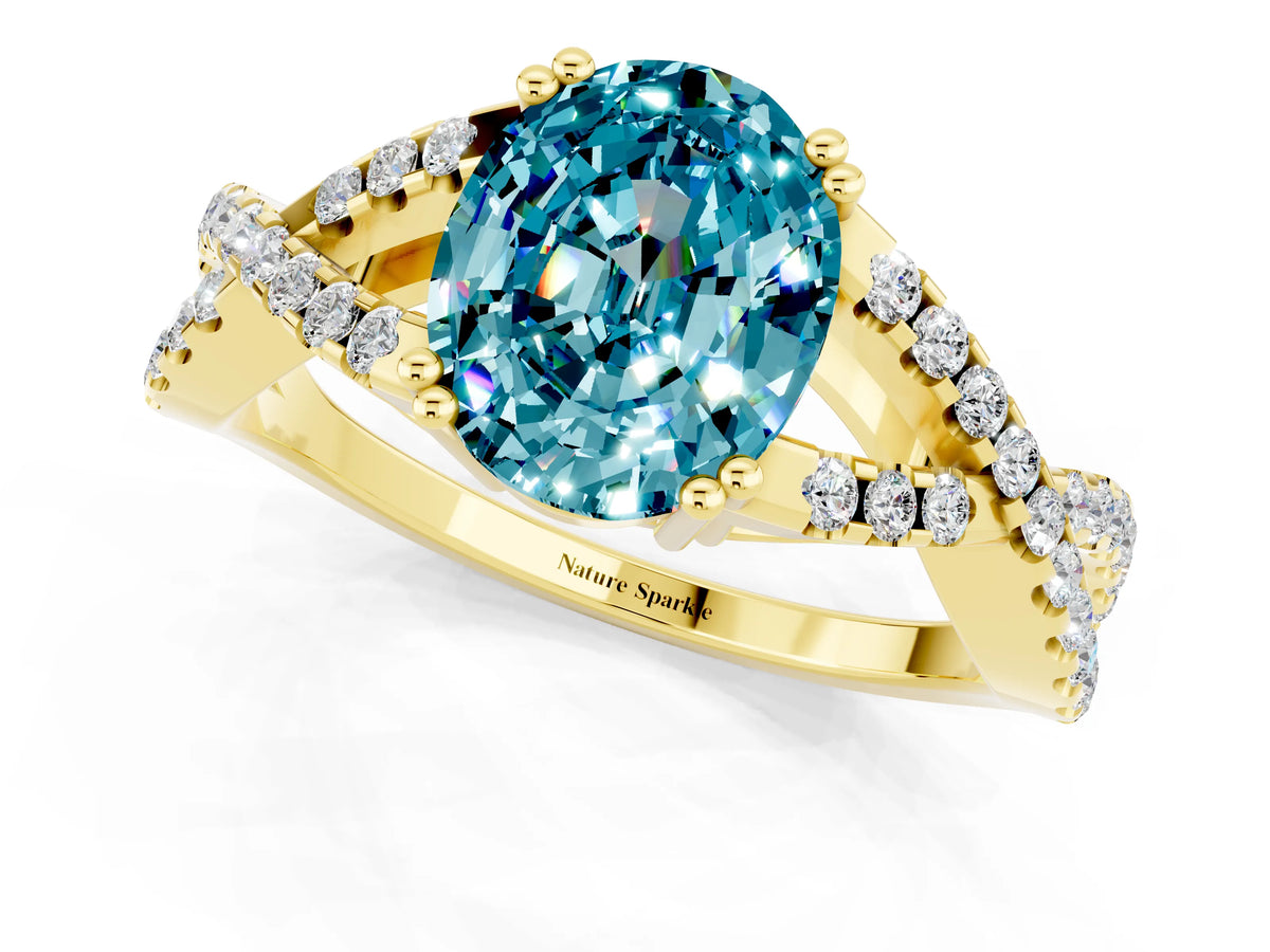Oval Cut Blue Topaz Solitaire Ring in Yellow gold with Interwoven Pavé Band and Prong Setting_1