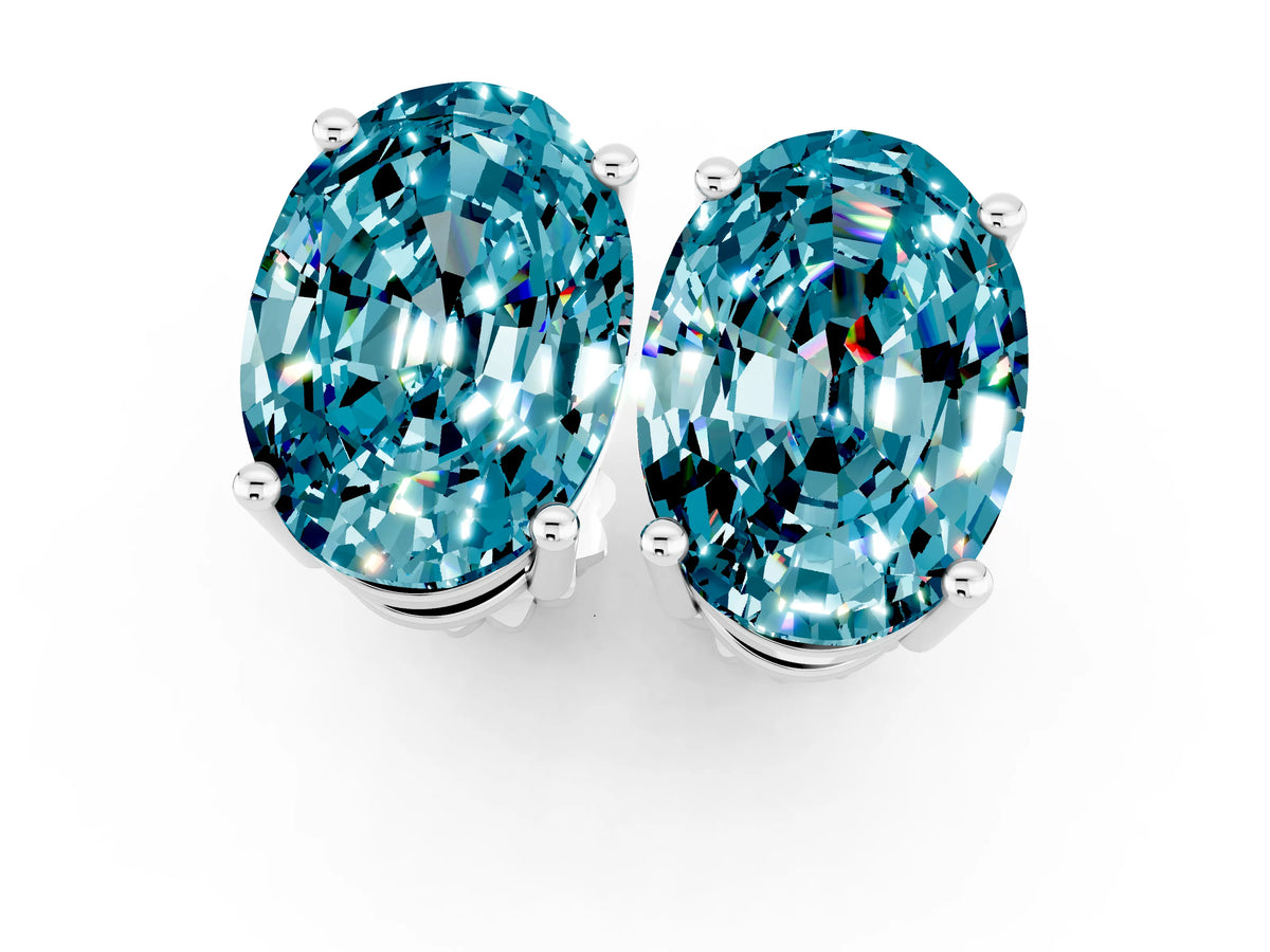 Oval Cut Blue Topaz Stud Earrings in White gold with Basket Setting_1