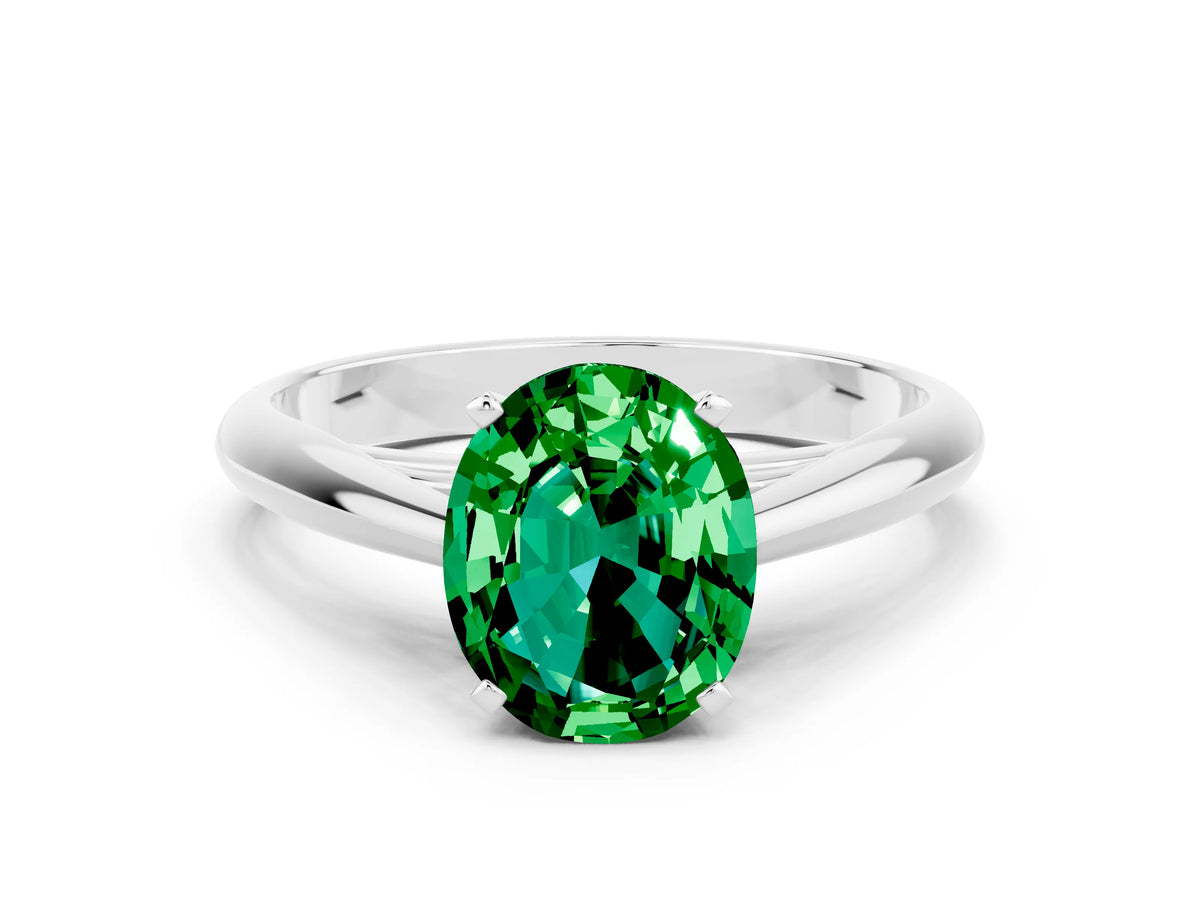 Oval Cut Emerald Cathedral Solitaire Engagement Ring in White gold with Prong Setting