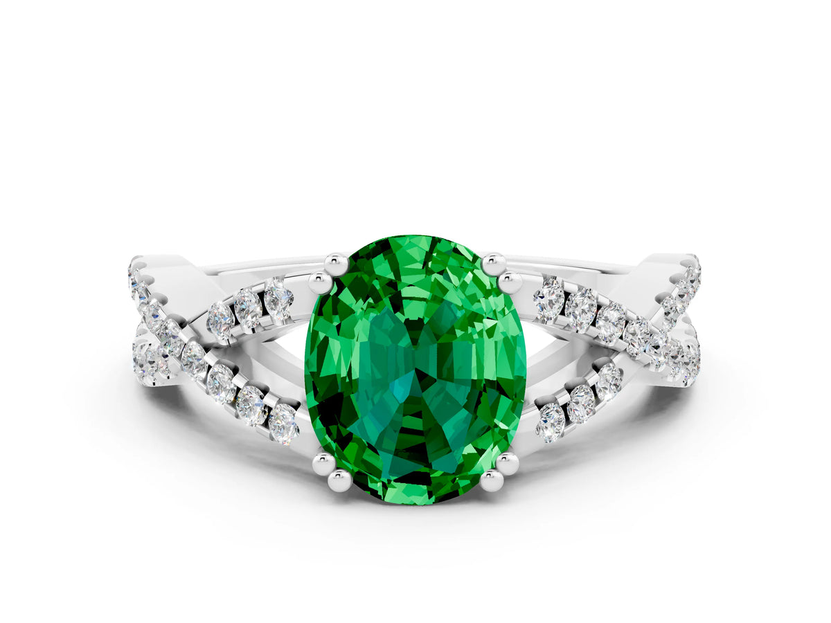 Oval Cut Emerald Solitaire Ring in White gold with Interwoven Pavé Band and Prong Setting