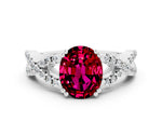 Oval Cut Garnet Solitaire Ring in White gold with Interwoven Pavé Band and Prong Setting
