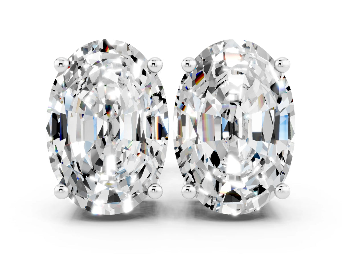 Oval Cut Moissanite Stud Earrings in White gold with Basket Setting