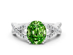 Oval Cut Peridot Solitaire Ring in White gold with Interwoven Pavé Band and Prong Setting