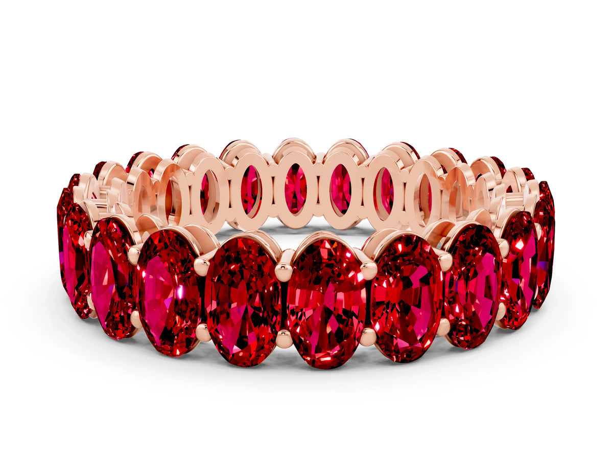 Oval Cut Ruby Eternity Band in Rose gold with Shared Prong Setting