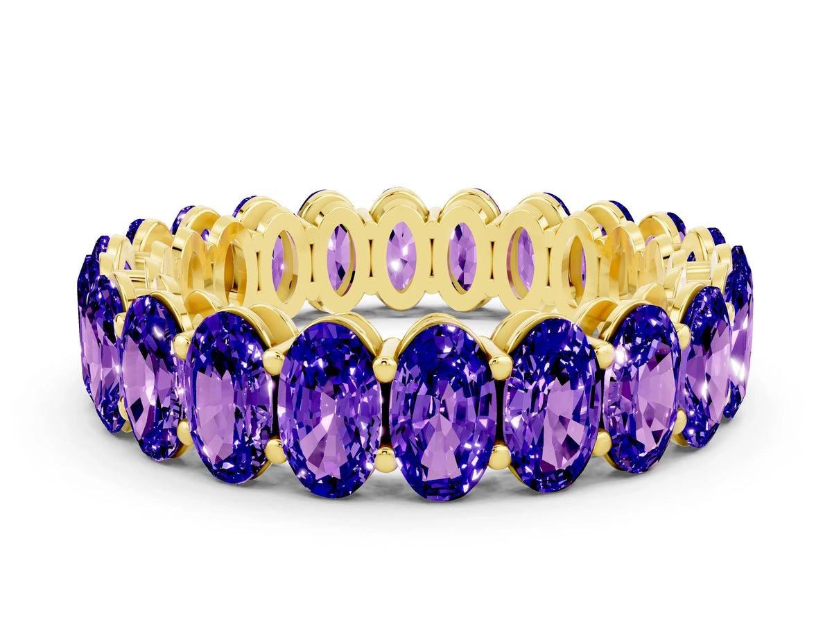 Oval Cut Tanzanite Eternity Band in Yellow gold with Shared Prong Setting