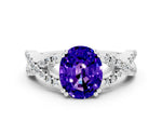 Oval Cut Tanzanite Solitaire Ring in White gold with Interwoven Pavé Band and Prong Setting