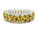 Oval Cut Yellow Sapphire Eternity Band in White gold with Shared Prong Setting