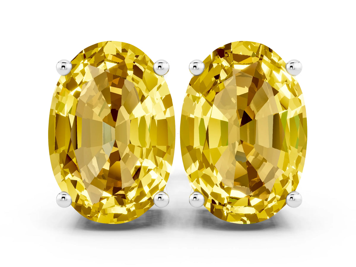 Oval Cut Yellow Sapphire Stud Earrings in White gold with Basket Setting