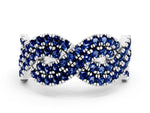 Pavé Round Blue Sapphire Infinity Twist Band in Silver with Shared Prong Setting